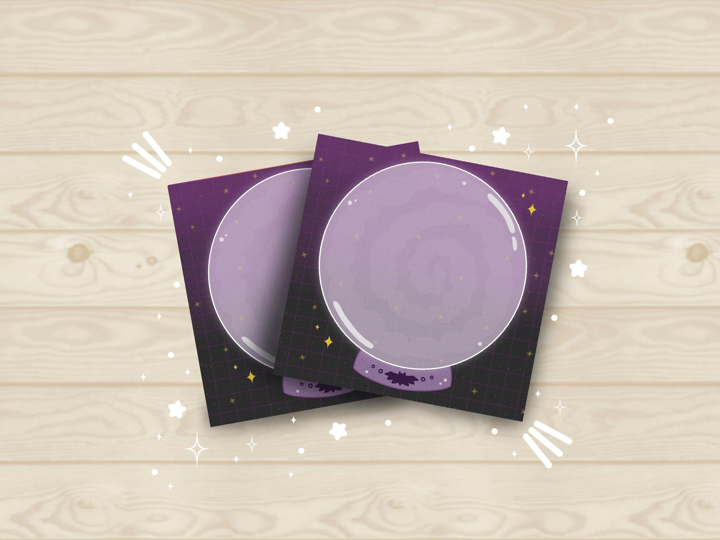 Purple and black sticky notes with a large purple crystal ball with smoke placed in the middle.