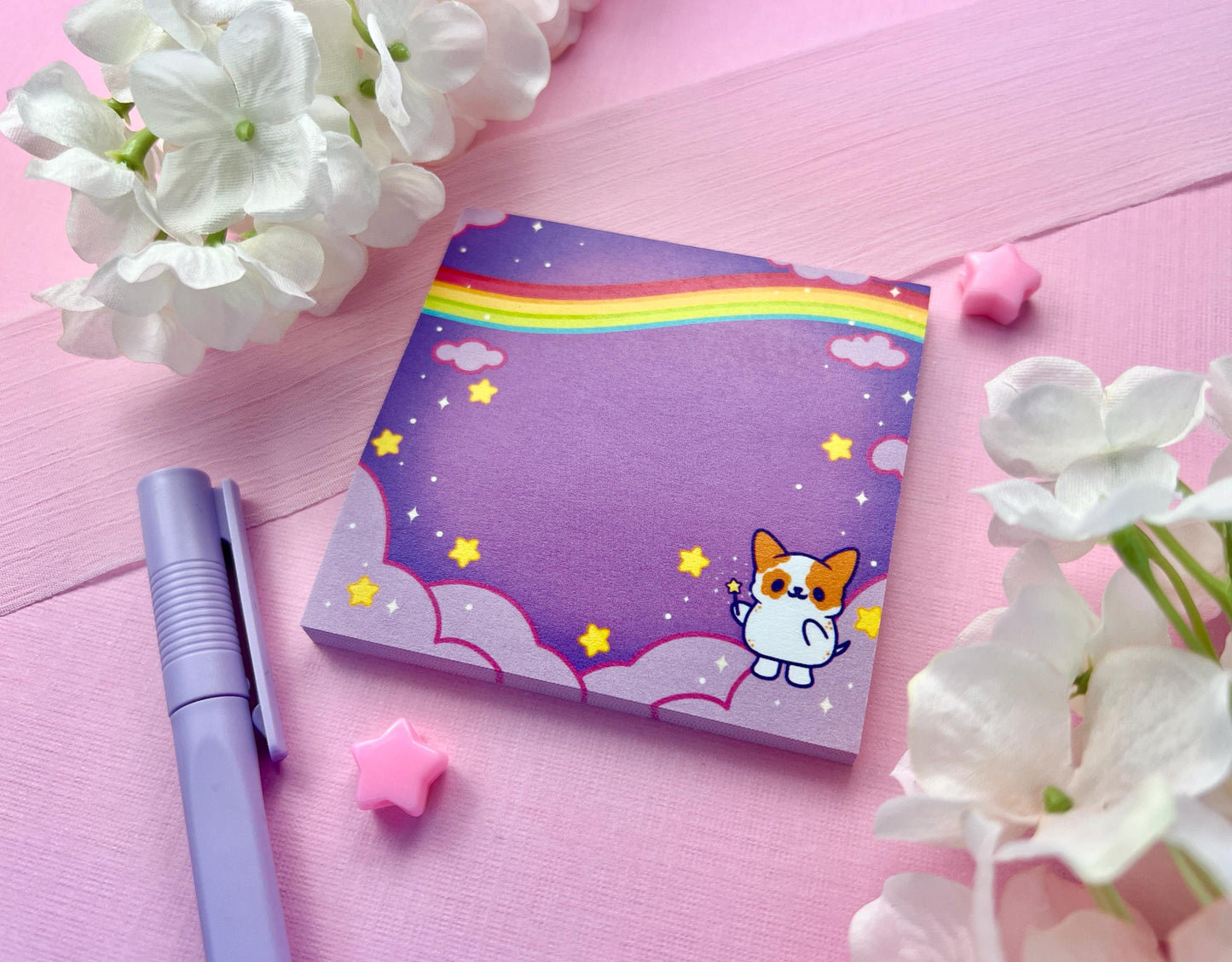 Purple sticky notes of a cute magical dog standing the the clouds below a rainbow surrounded by yellow stars holding a magical wand.