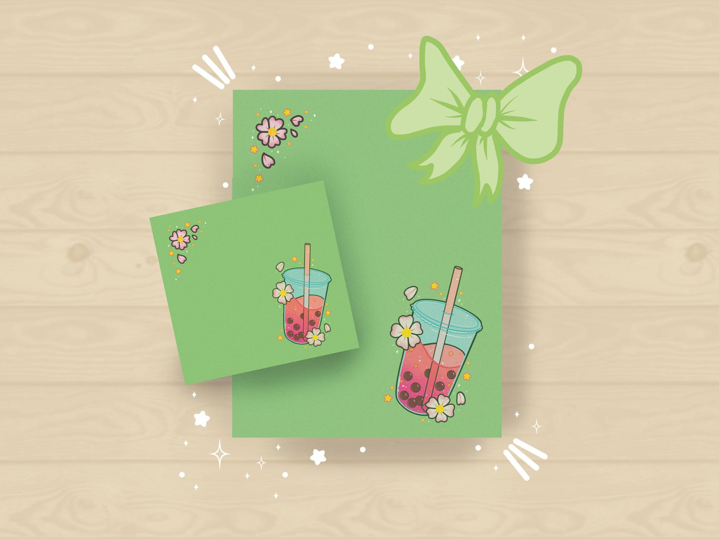 Pastel gift set with milk tea and cherry blossom designs in green on sticky notes and notepad