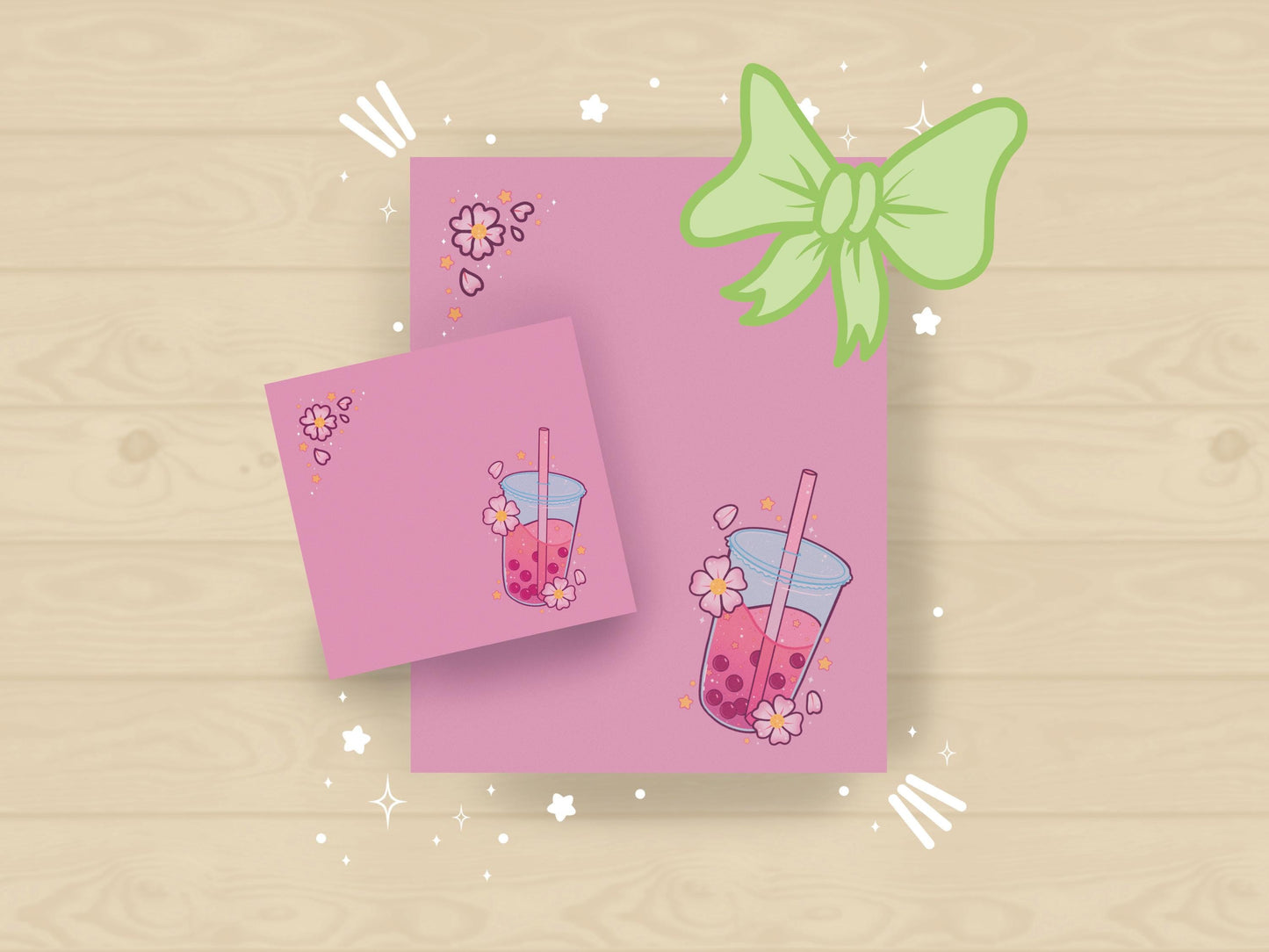 Pastel gift set with milk tea and cherry blossom designs in pink on sticky notes and notepad