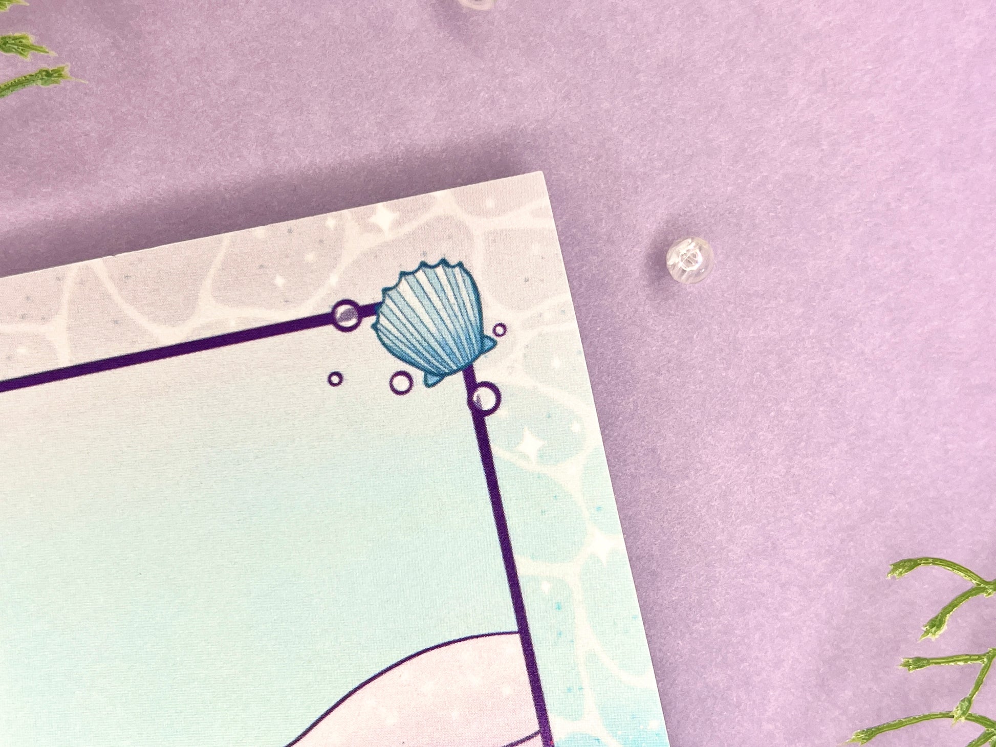Sticky note pad with pastel seashells and sand designs, measuring 3 in x 3 in, perfect for ocean-themed stationery lovers