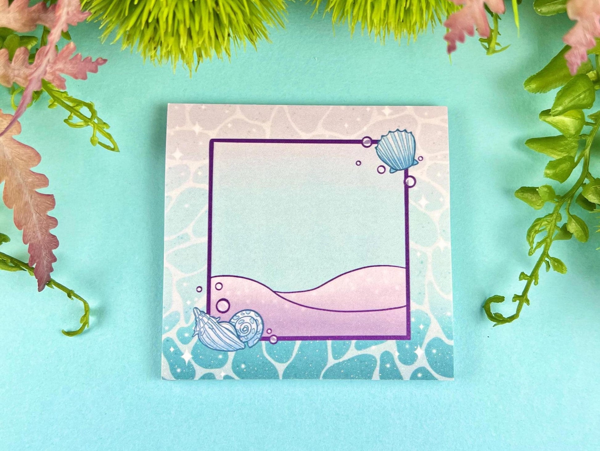 Sticky note pad with pastel seashells and sand designs, measuring 3 in x 3 in, perfect for ocean-themed stationery lovers