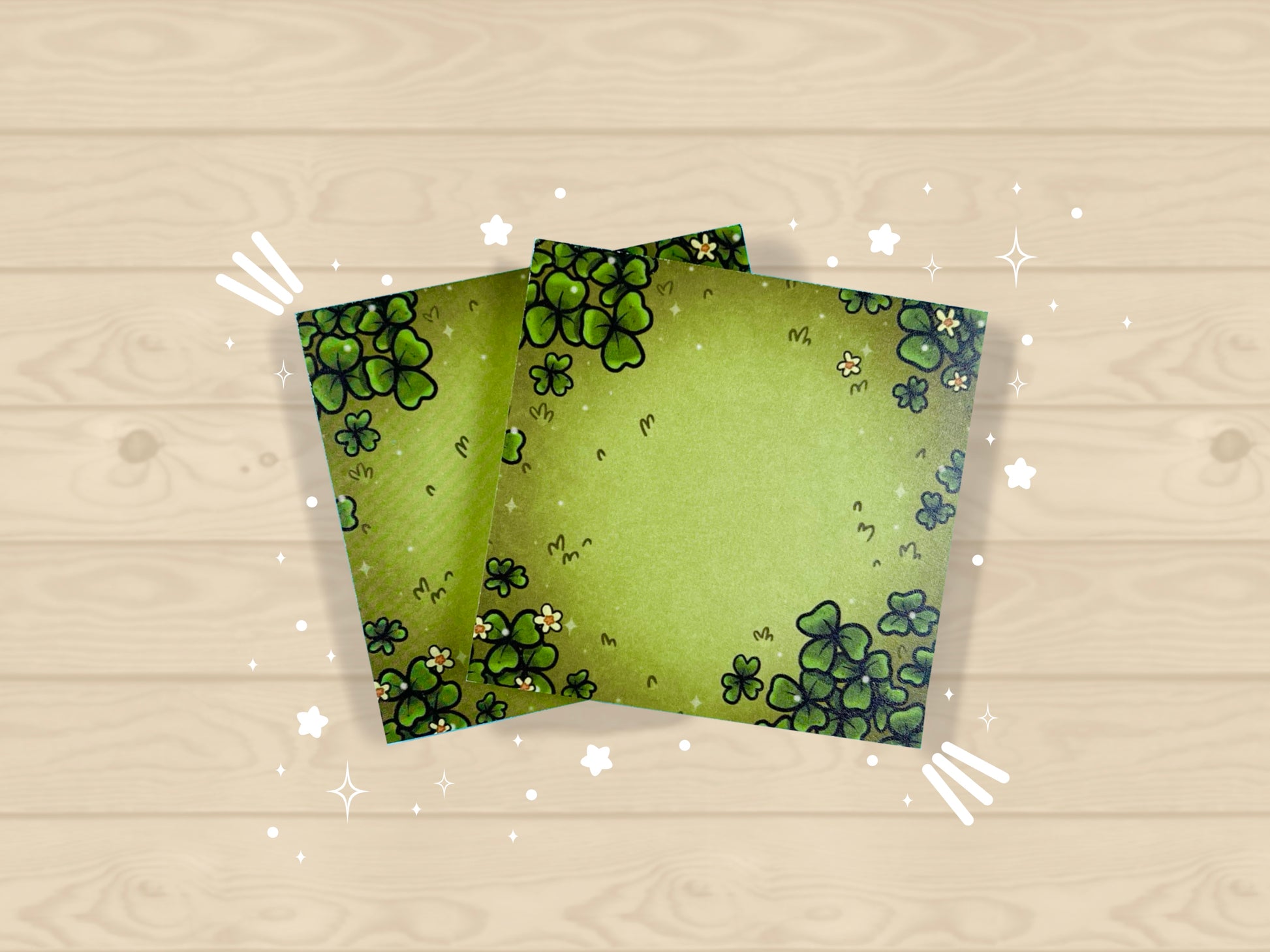 Green sticky notes of a field of green clovers, grass, and yellow flowers.