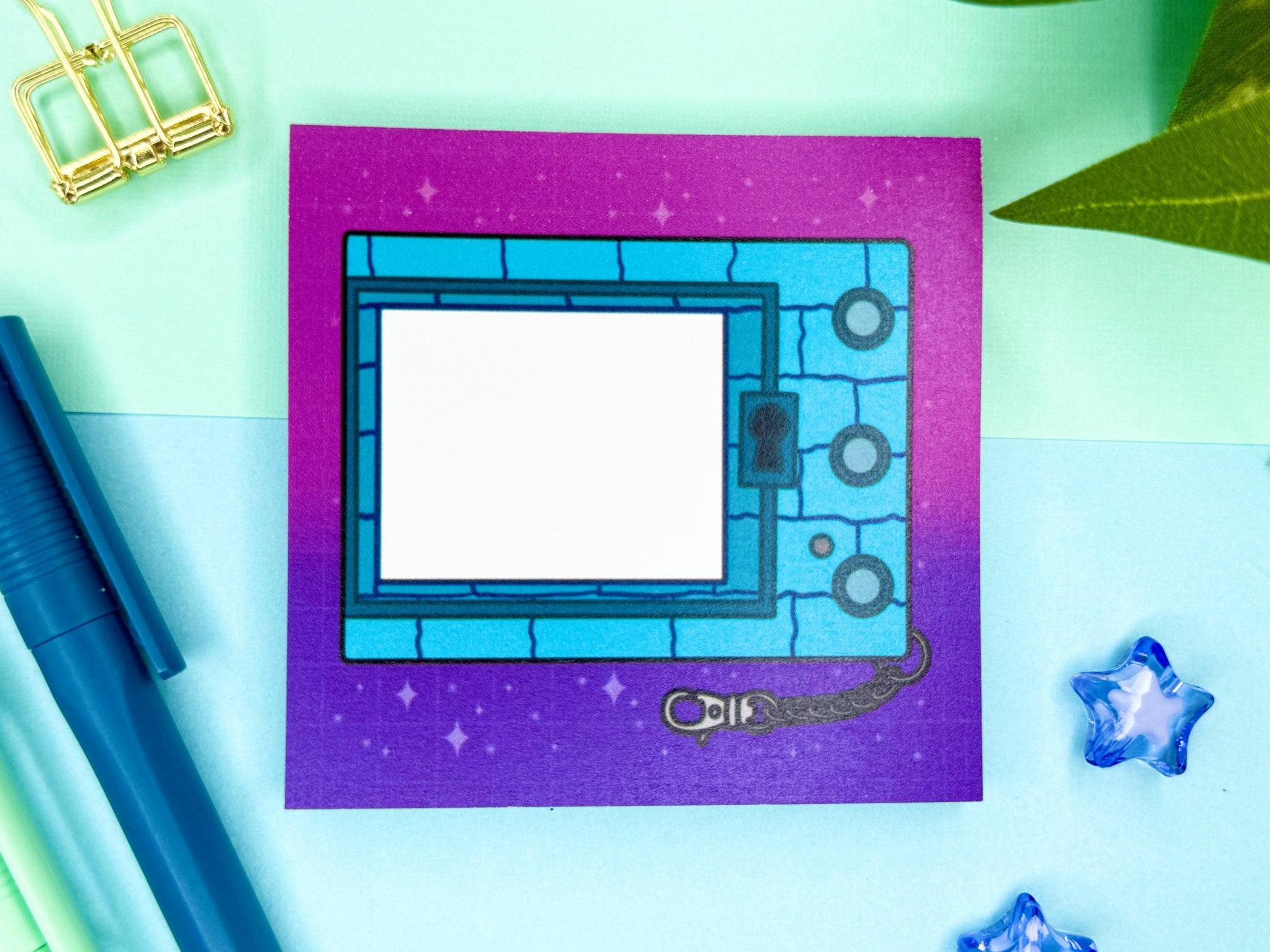 Digital blue pet game console keychain with a pink and purple background.