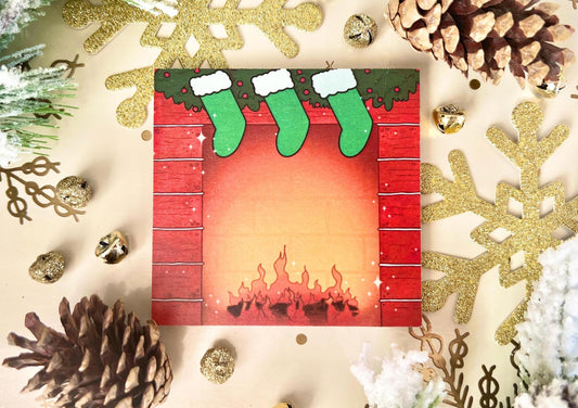 Holiday themed sticky notes of a red bricked fireplace, green hung stockings and green garland on top, with a log fire lit at the bottom.
