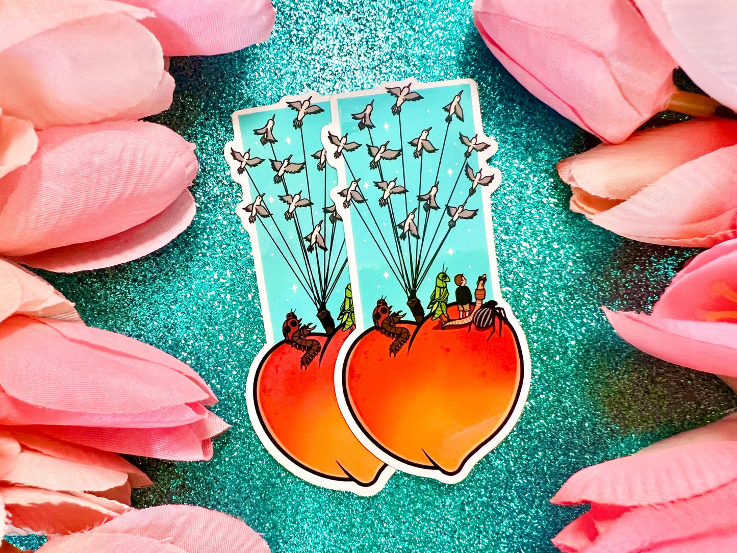 Sticker of a giant peach with people and bugs being carried by birds on a colorful blue background.