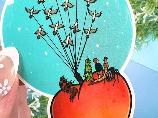 Sticker of a giant peach with people and bugs being carried by birds on a colorful blue background.
