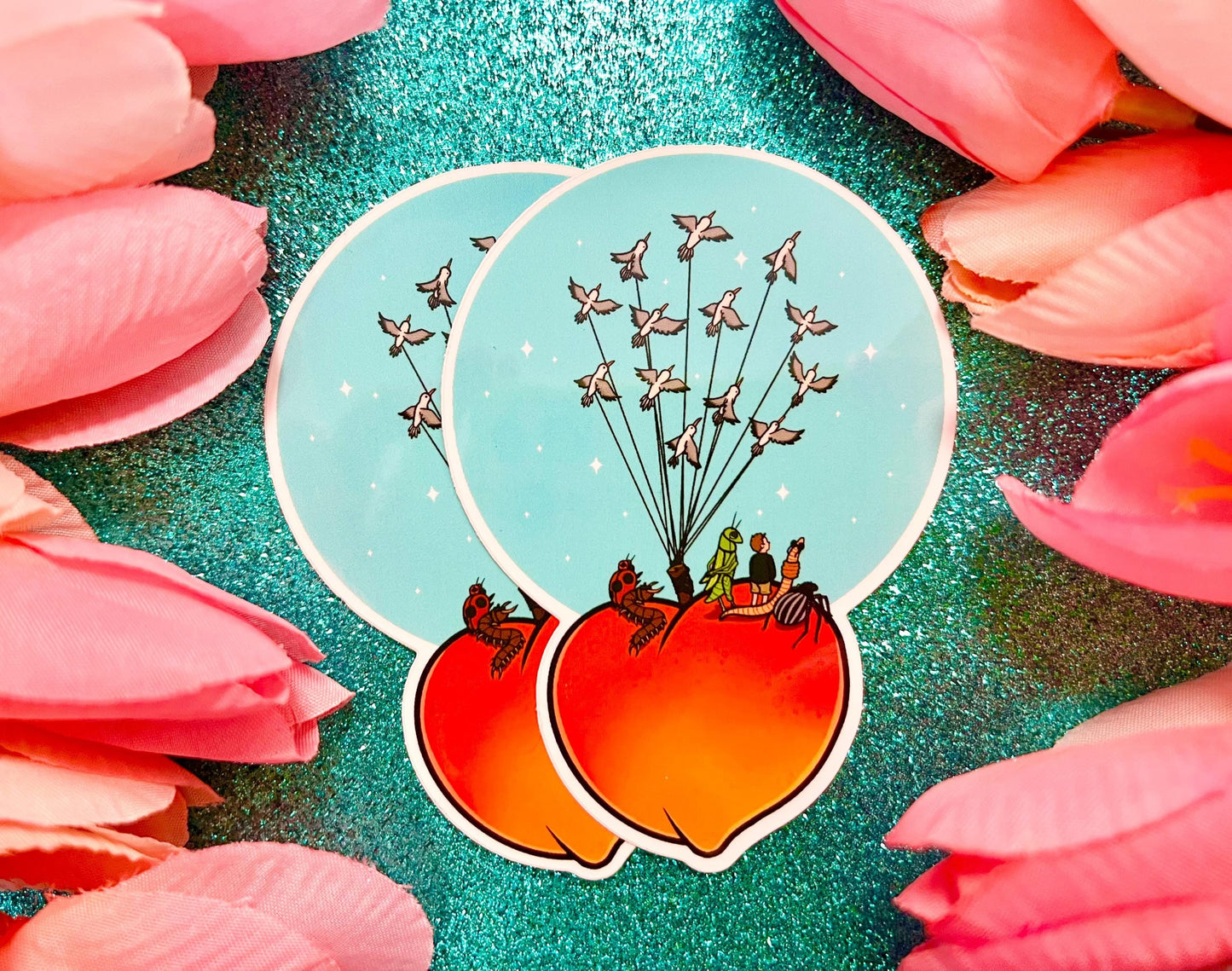 Sticker of a giant peach with people and bugs being carried by birds on a colorful blue background.