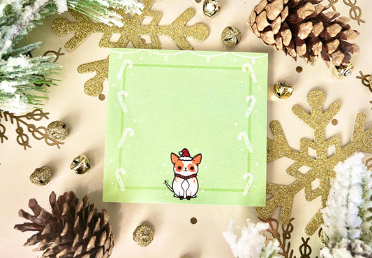 Green sticky notes with white string lights at the top, white candy canes along the sides, and a cute dog wearing a Santa Hat on the bottom.