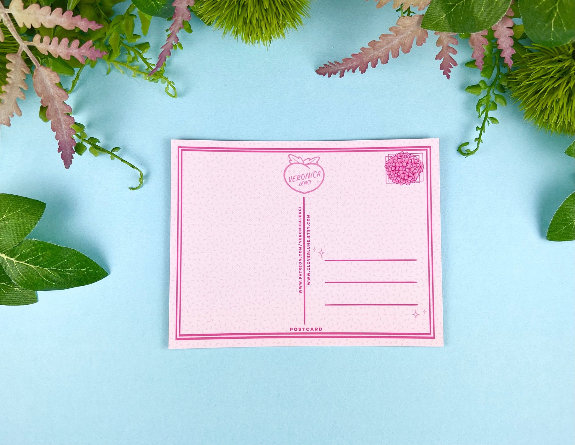 Back of the postcard with a line down the middle, lines on the right side for and address, and a cute hydrangea flower illustration where the stamp would go. 