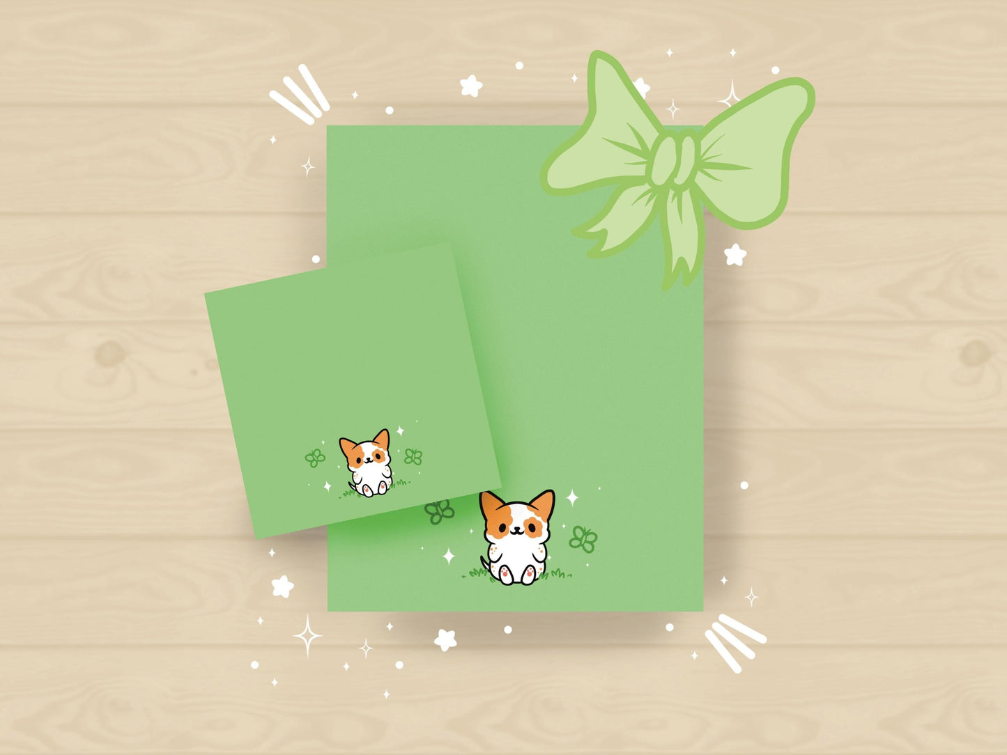 A sticky note and notepad gift set with a dog illustration on a green background surrounded by butterflies.
