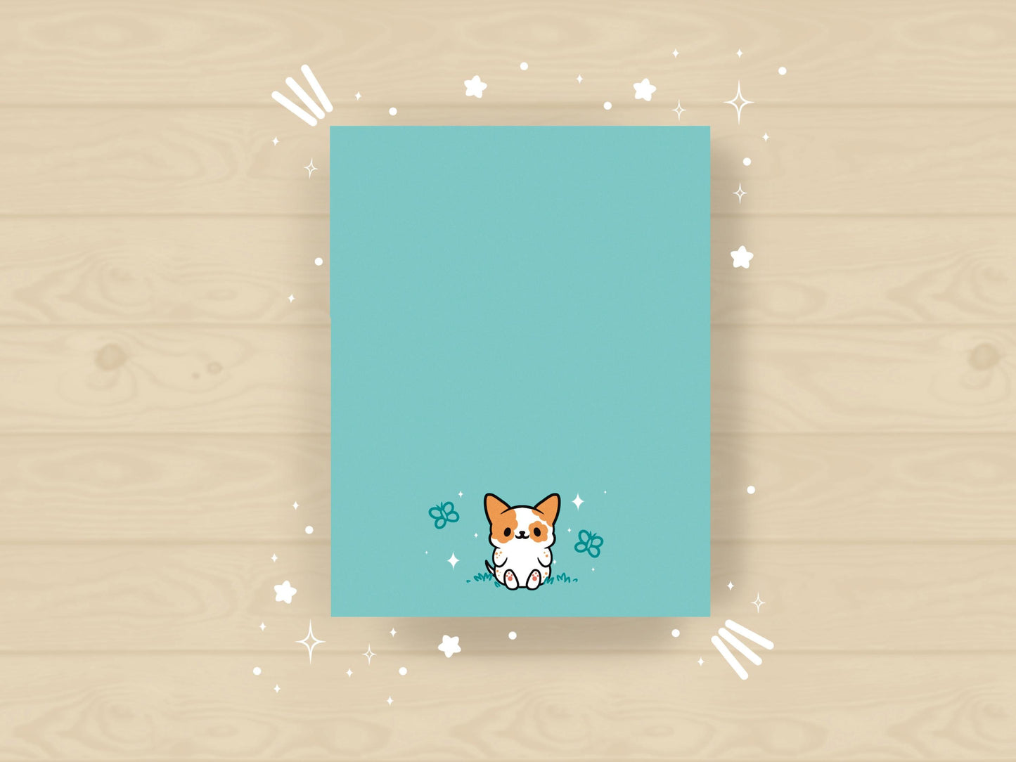 Light blue notepad with an illustration of a cute dog sitting among the butterflies.