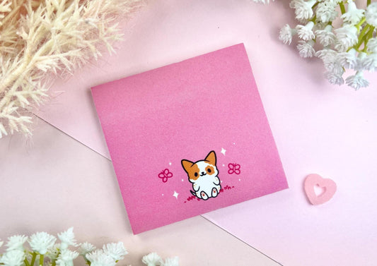 Sticky note with a dog illustration on a pink background surrounded by butterflies