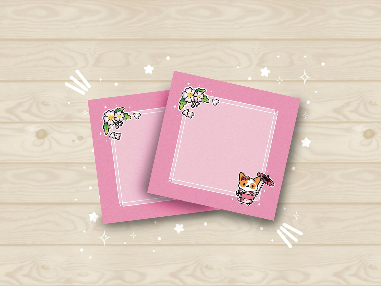 Pink sticky notes that have an illustration of a cute dog wearing a pink kimono holding an umbrella under cherry blossoms. 