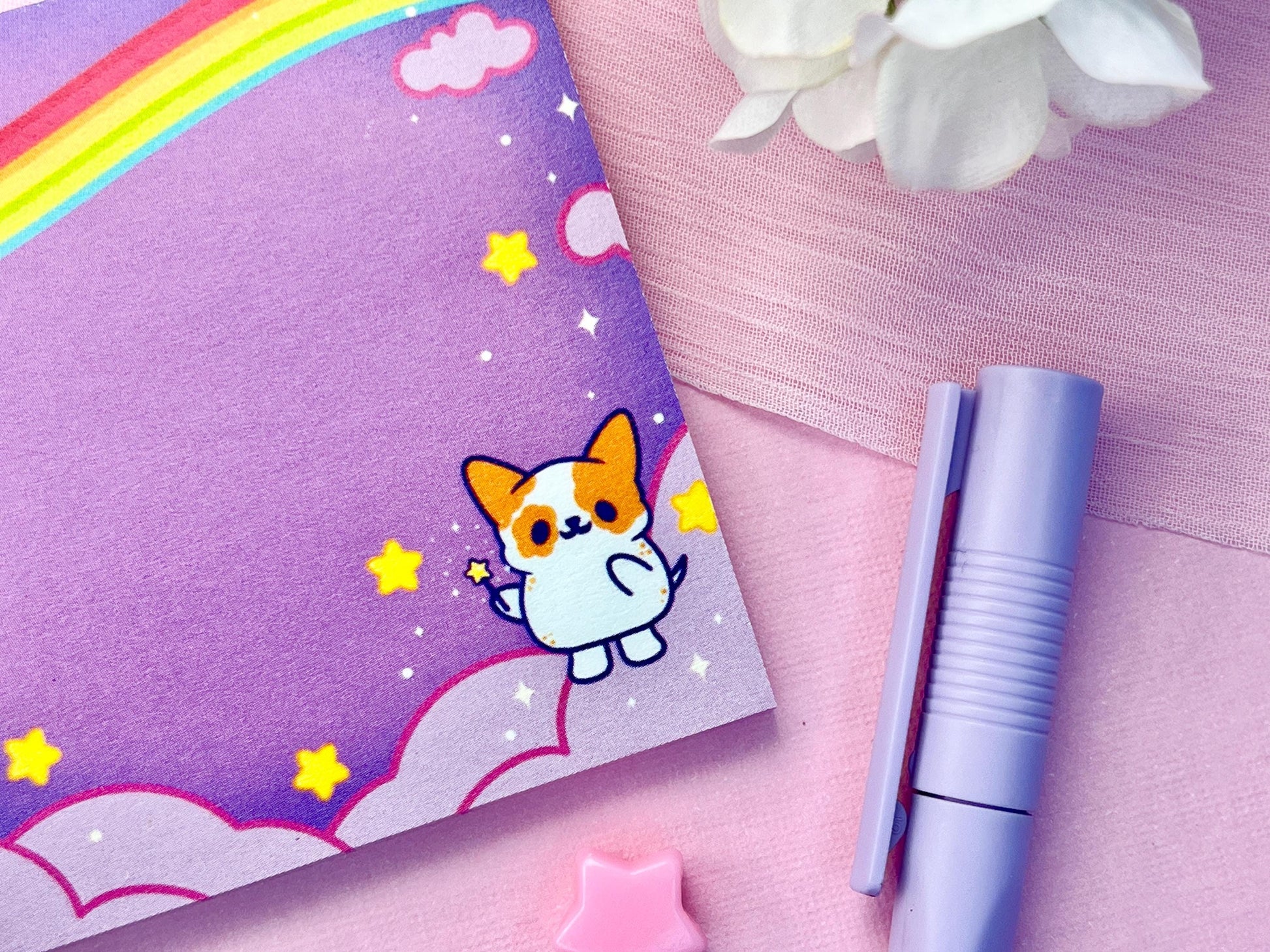 Purple sticky notes of a cute magical dog standing the the clouds below a rainbow surrounded by yellow stars holding a magical wand.