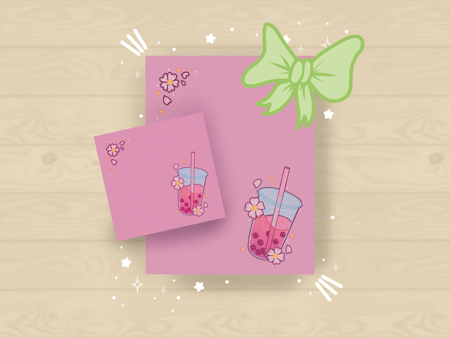 A pink gift set including one sticky note and one notepad with an illustration of pink boba milk tea surrounded by pink flowers.