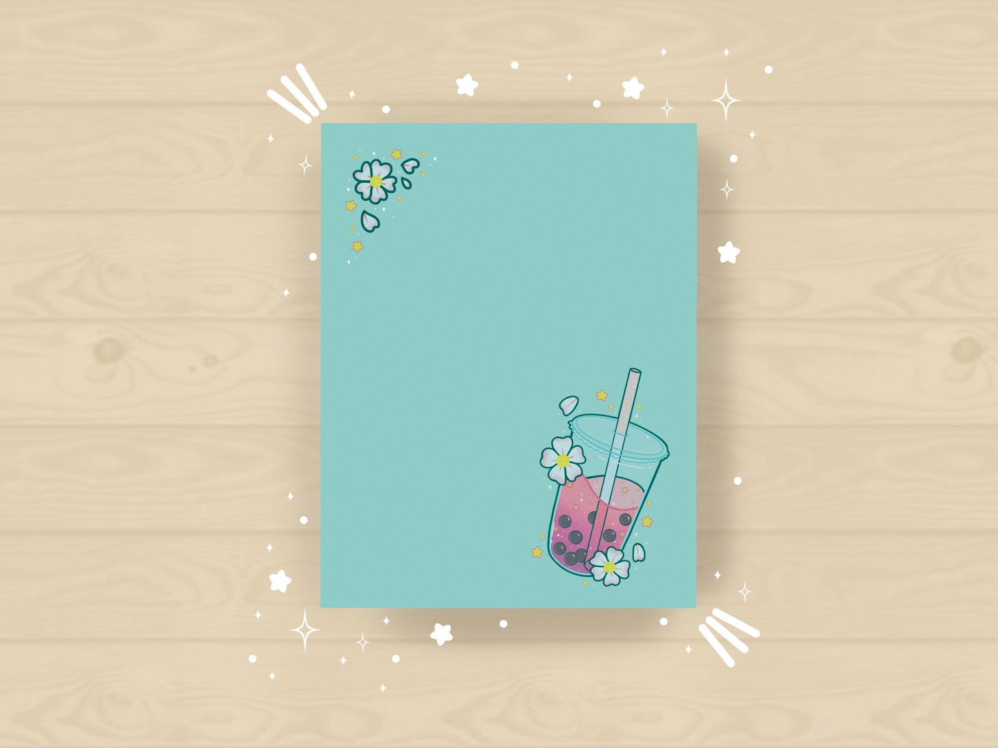 Light blue notepad with an illustration of pink boba milk tea surrounded by pink flowers.