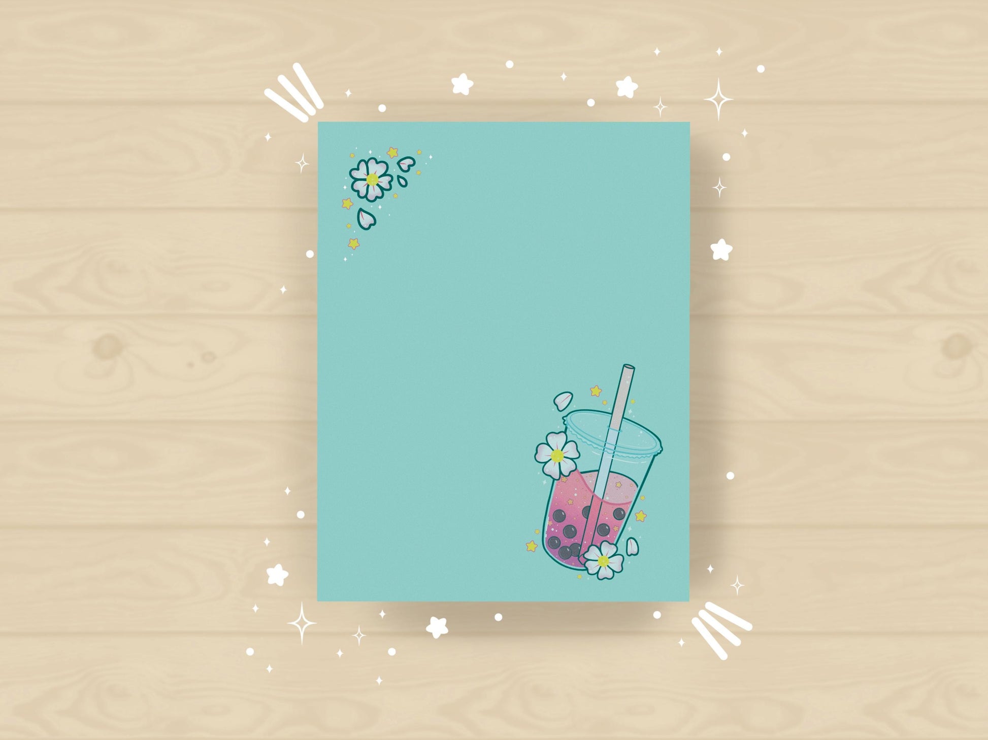 Light blue notepad with an illustration of pink boba milk tea surrounded by pink flowers.