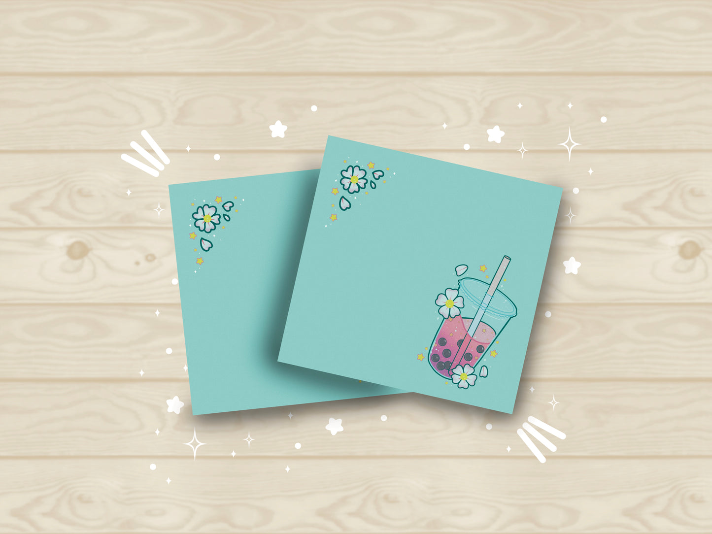 Light blue sticky notes with an illustration of pink boba milk tea surrounded by pink flowers.