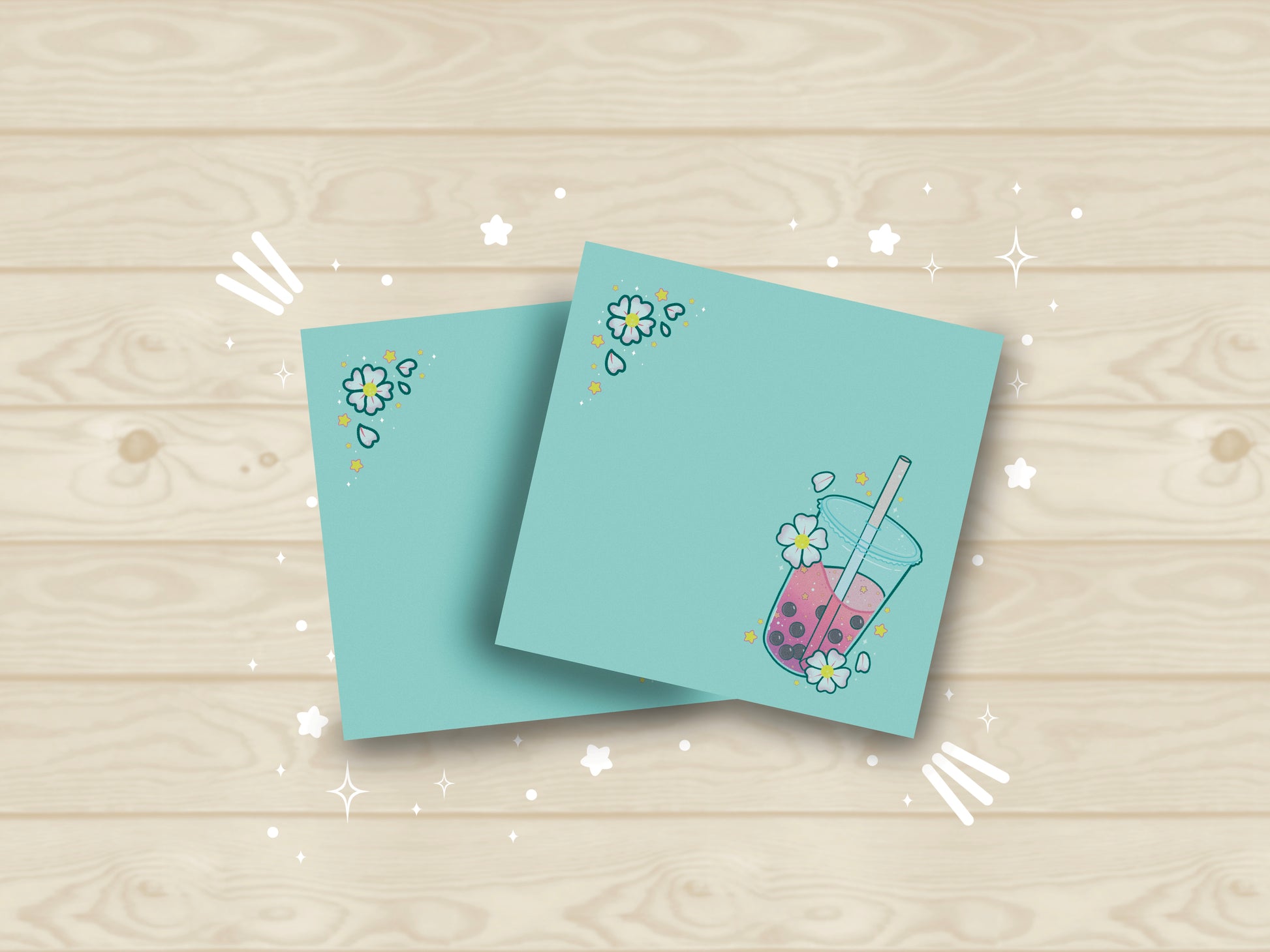 Light blue sticky notes with an illustration of pink boba milk tea surrounded by pink flowers.