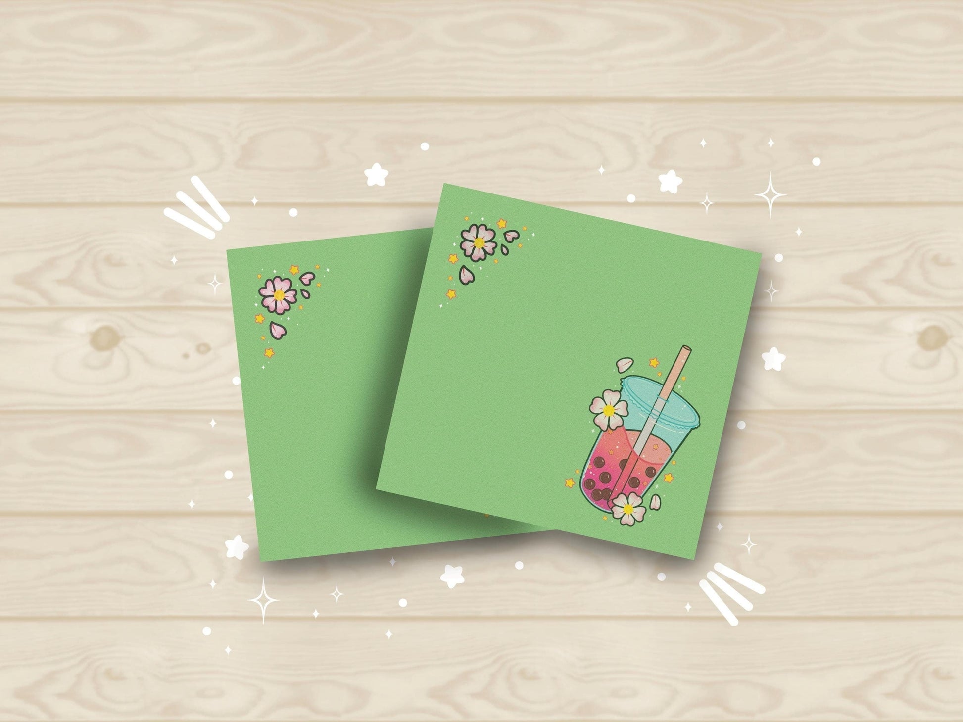 Light green sticky note with an illustration of pink boba milk tea surrounded by pink flowers and yellow stars.