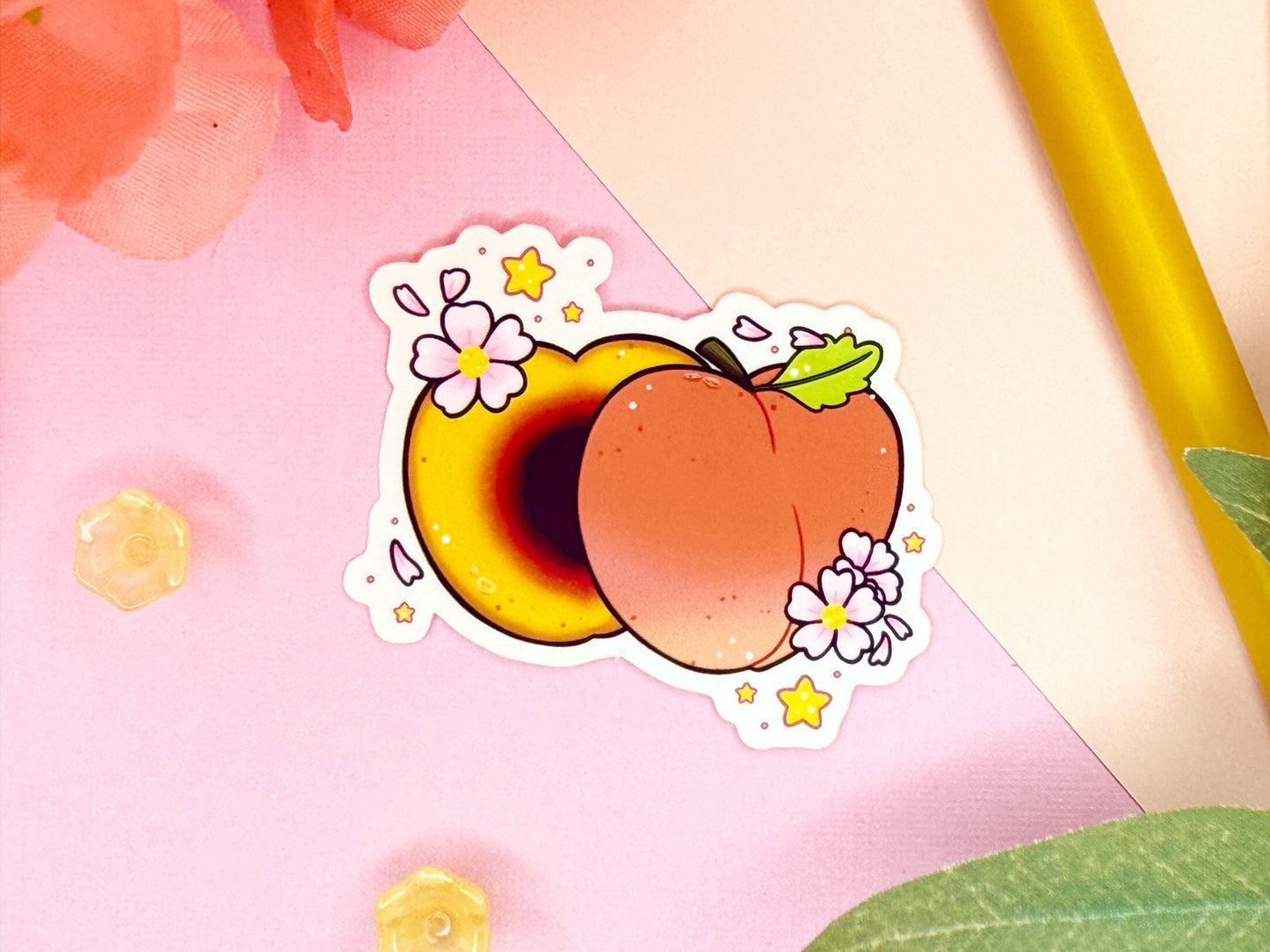 Sticker of a peach with flowers on a pink background with floral and plant elements.