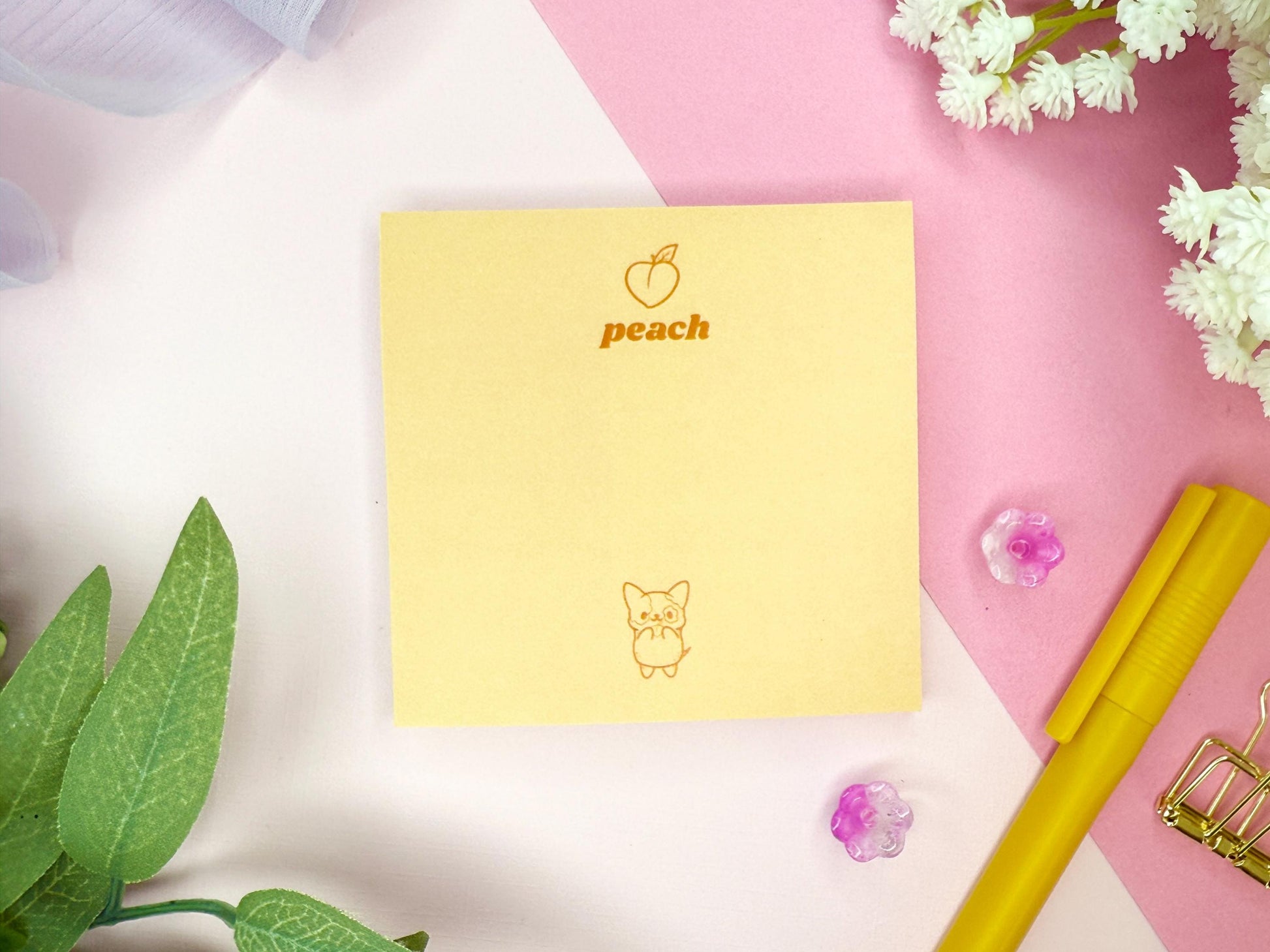 Yellow notepad with 'peach' branding and a cute dog on a pink and white background with decorative elements.