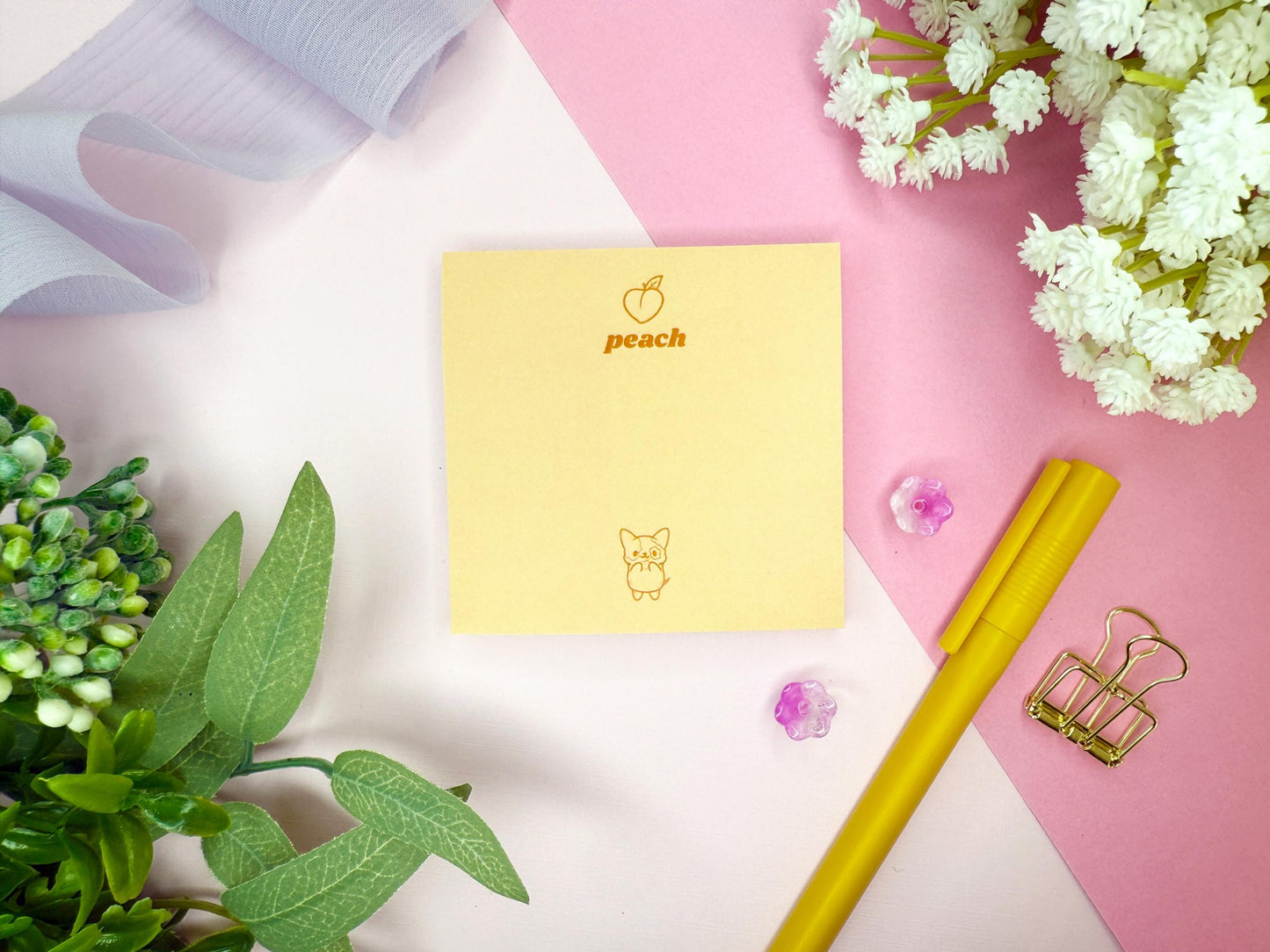 Yellow notepad with 'peach' branding and a cute dog on a pink and white background with decorative elements.