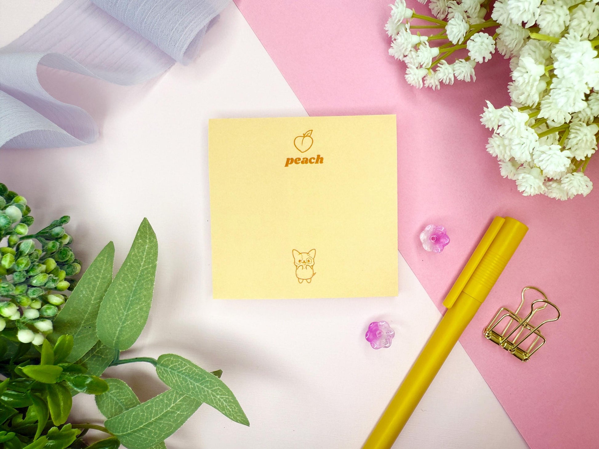 Yellow notepad with 'peach' branding and a cute dog on a pink and white background with decorative elements.