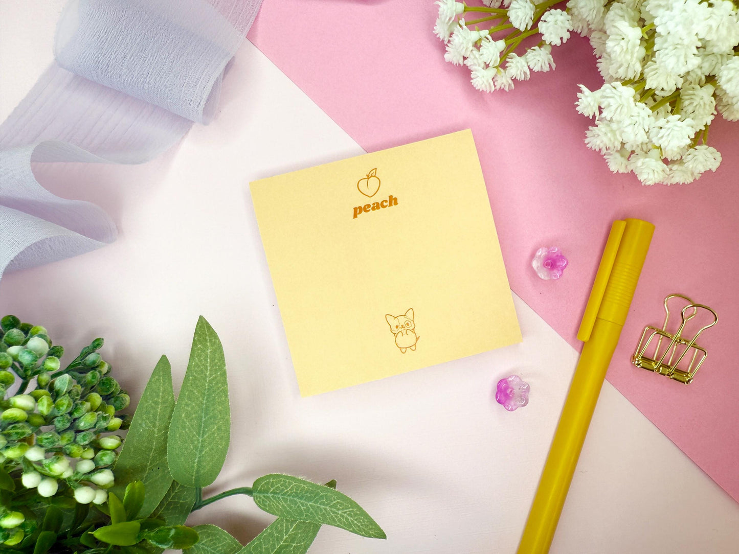 Yellow notepad with 'peach' branding and a cute dog on a pink and white background with decorative elements.