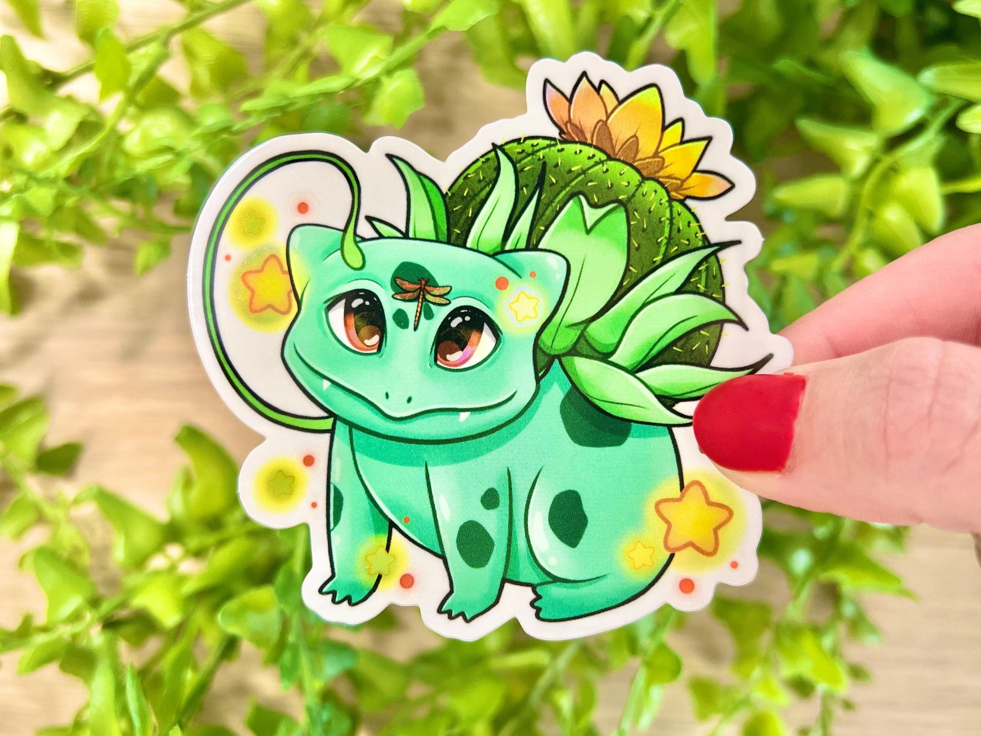 Vinyl sticker of a green leafy plant creature with cozy cottagecore forest aesthetic