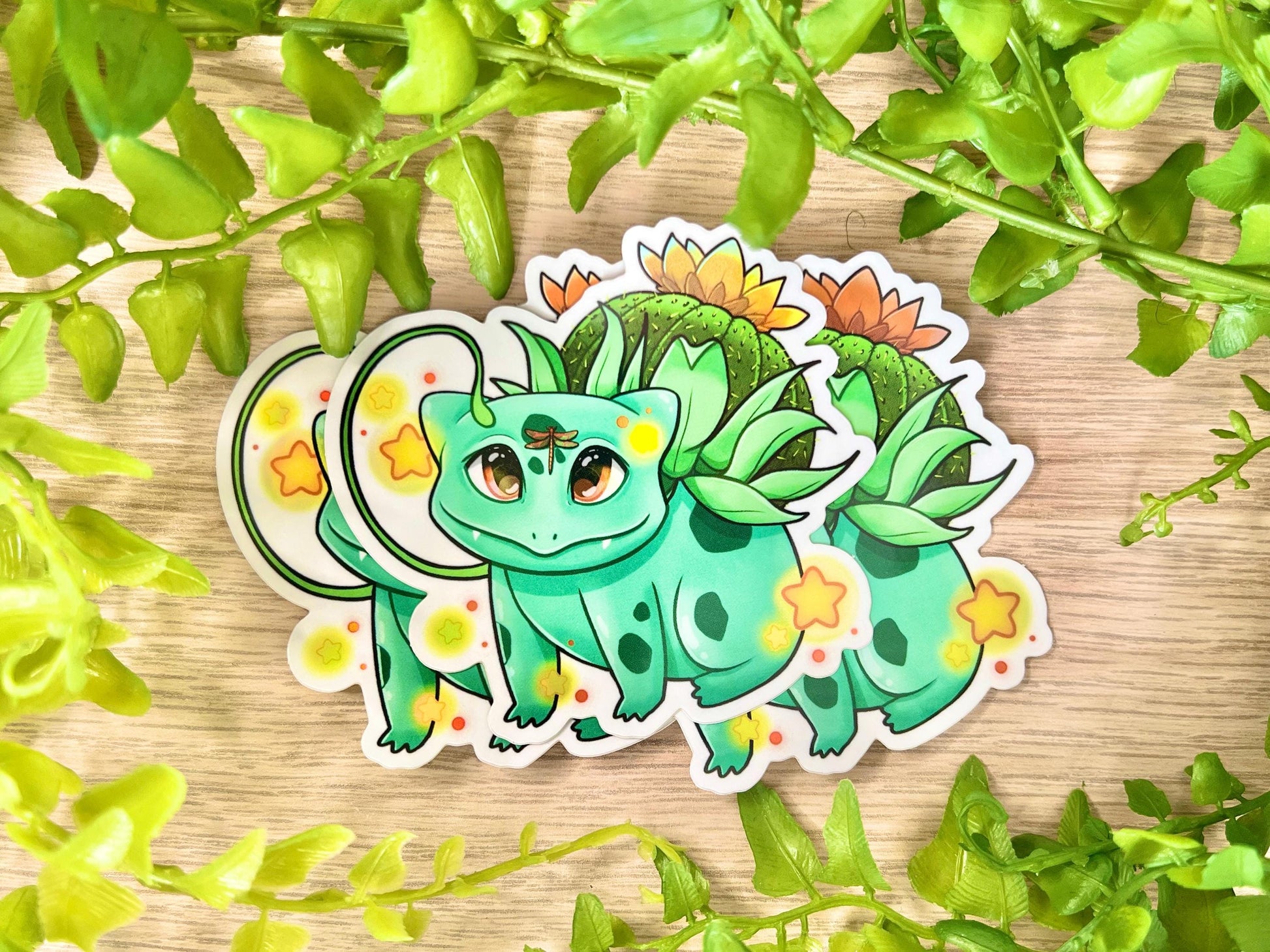 Vinyl sticker of a green leafy plant creature with cozy cottagecore forest aesthetic