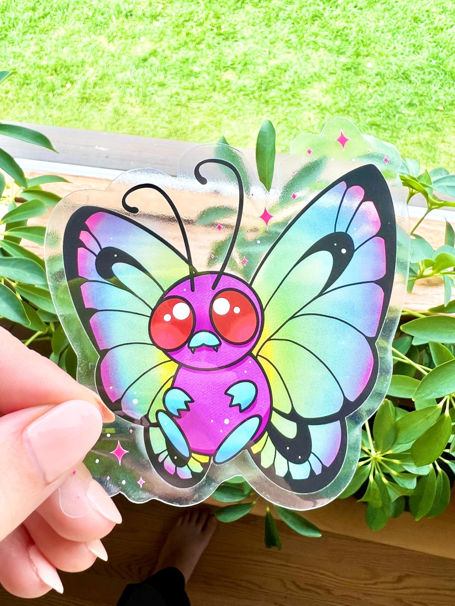 Cute colorful rainbow butterfly on a clear background sticker.