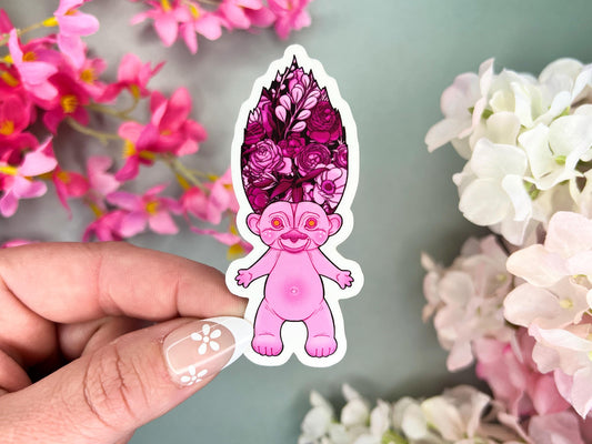A pink retro hair creature with pink hair made to look like a bouquet of flowers.