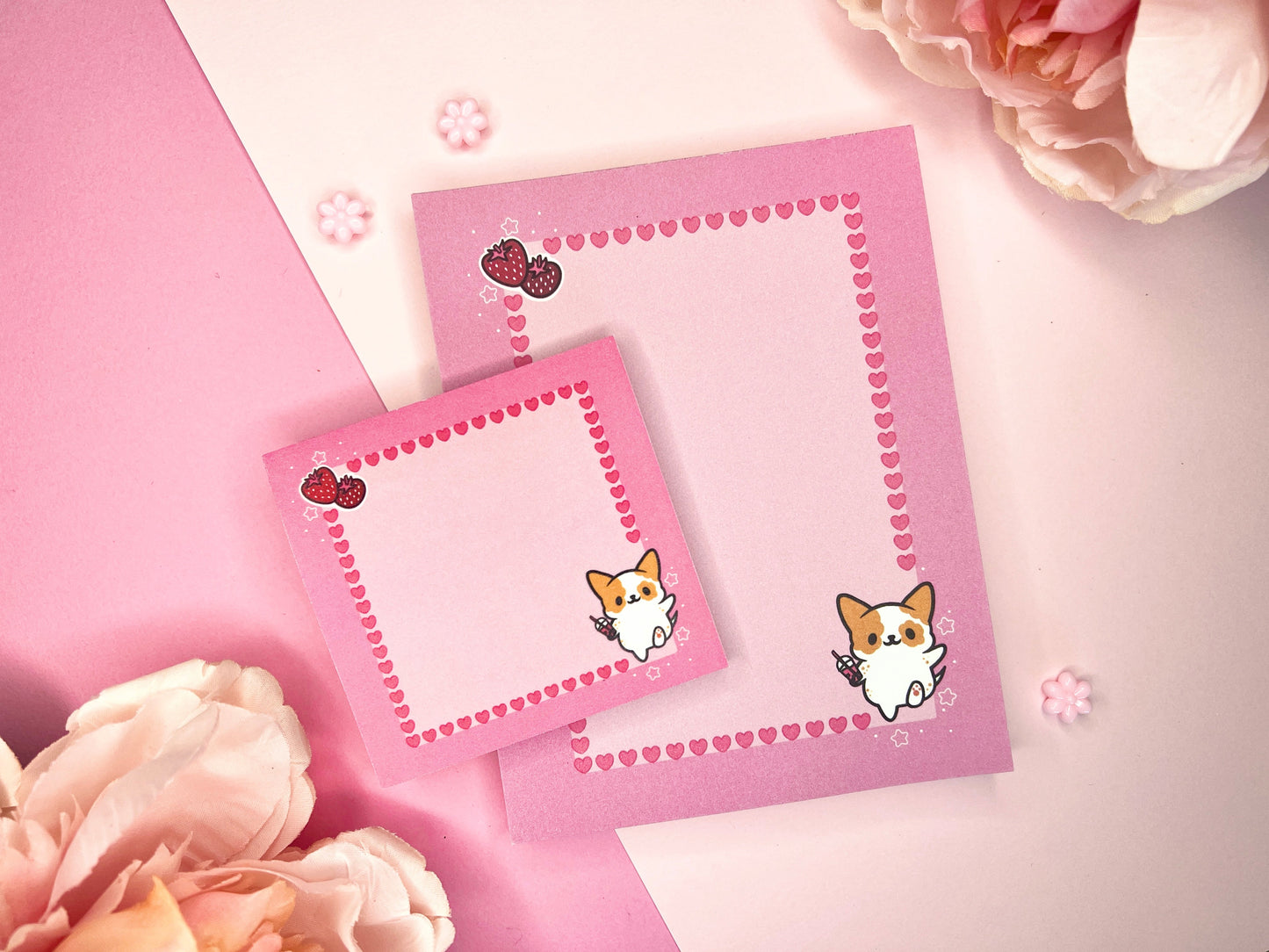 Pink gift set including one sticky note pad and one notepad with an illustration of a cute dog holding boba milk tea surrounded by hearts and strawberries.
