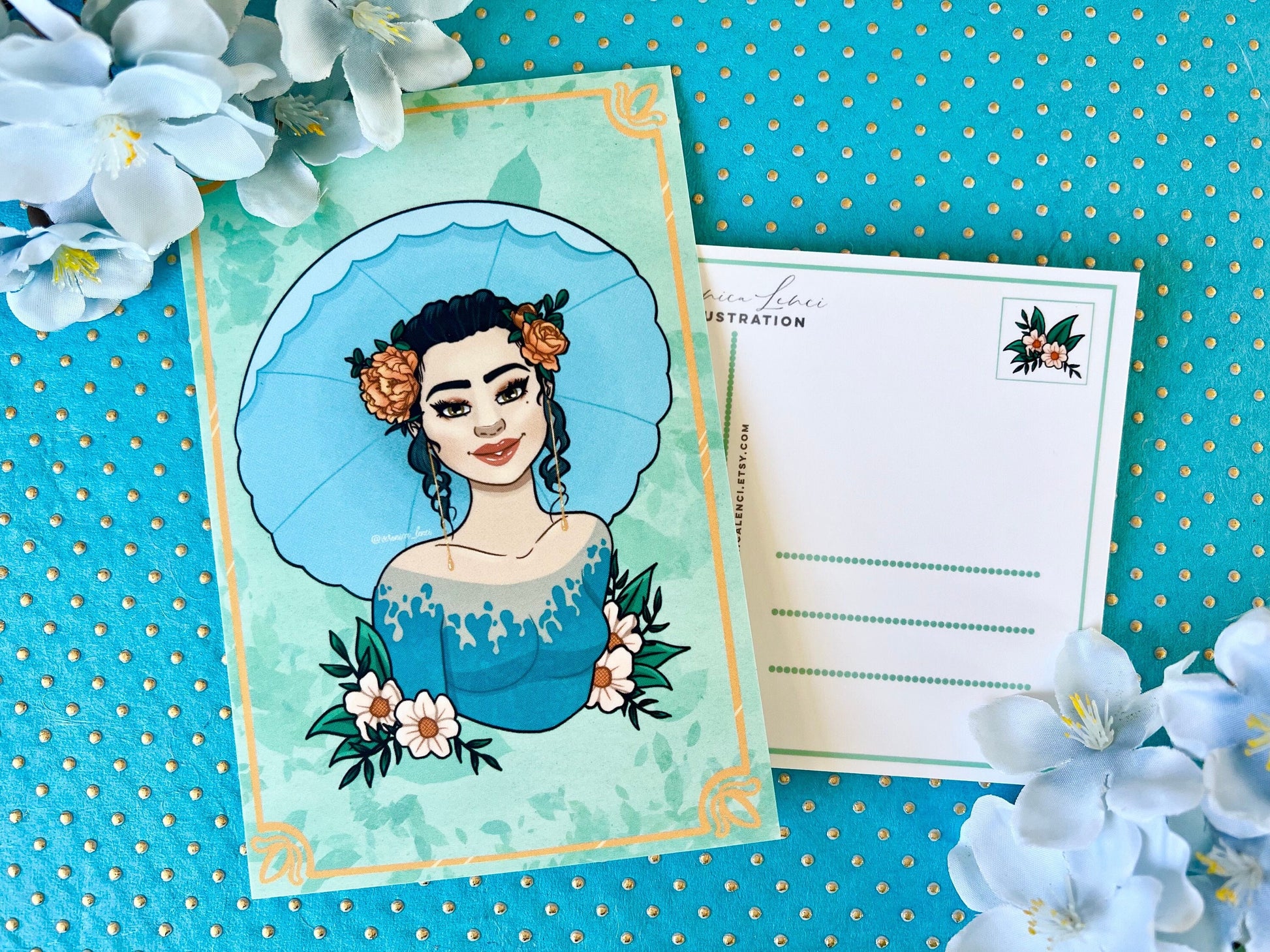 Illustrated card with a woman's portrait holding an umbrella on a blue polka dot background with orange and white flowers.