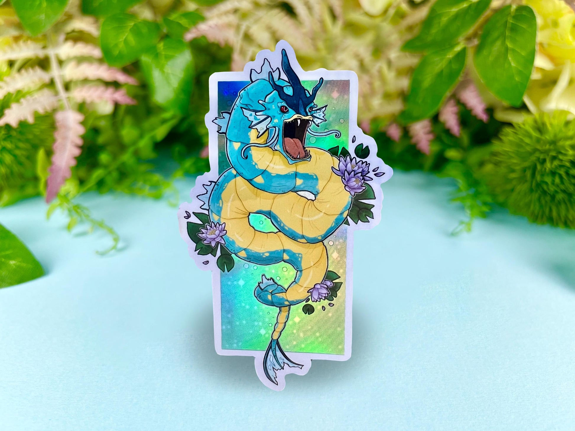 Holographic sticker of a fierce blue water dragon sea serpent with retro shiny style